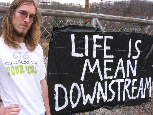 Photo: Gabe Dunsmith is pictured in front of the CTS Superfund site, 10 years after being diagnosed and treated for thyroid cancer. His doctor attributed his cancer to the environment. Photo courtesy of Gabe Dunsmith.