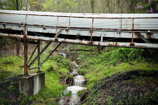 PHOTO: Kentuckians are advocating for clean-water protections as the state updates its discharge regulations on coal operations, such as this coal conveyor outside Portal 31 in Benham. Photo credit: Shawn Poynter/Rural Archive and Kentuckians For The Commonwealth.