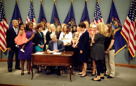 PHOTO: With moms and babies on hand, Gov. Rick Snyder signed the Breastfeeding Anti-Discrimination Act into law on Tuesday, giving Michigan women the right to breastfeed in public. Photo credit: L.  Posthumus