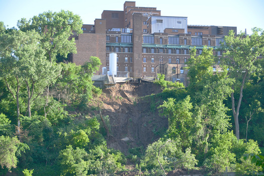 PHOTO: The mudslide behind the University of Minnesota hospital complex in Minneapolis is part of the aftermath of June's flash-flooding. Natural disasters are among the only 'negatives' in Minnesota's recent ranking as one of the safest places to live. Photo credit: August Schwerdfeger/Flickr