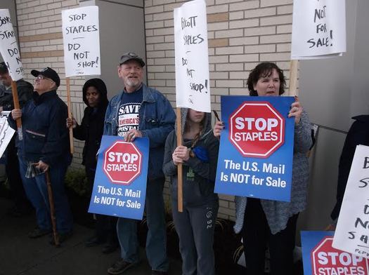 PHOTO: The West Virginia AFL-CIO is asking people to boycott the Staples retail chain. Protests, like this one in Portland, Ore., are focused on an agreement between the U.S. Postal Service and Staples to offer postal service in stores, by Staples employees instead of USPS workers. Photo credit: Jamie Partridge.
