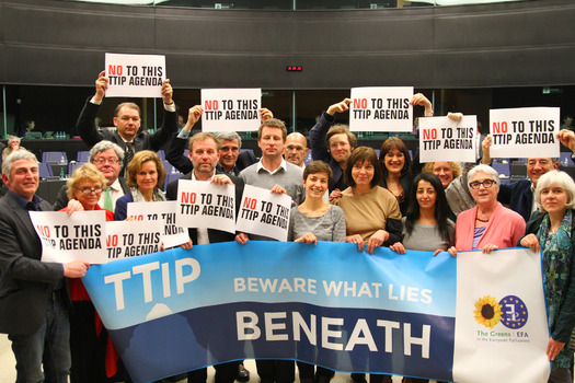 PHOTO: Those opposed to the Transatlantic Trade and Investment Partnership (T-TIP) protested during negotiations in March in Brussels, where the latest round of talks is underway this week. Photo credit: Greens / European Free Alliance / Flickr.