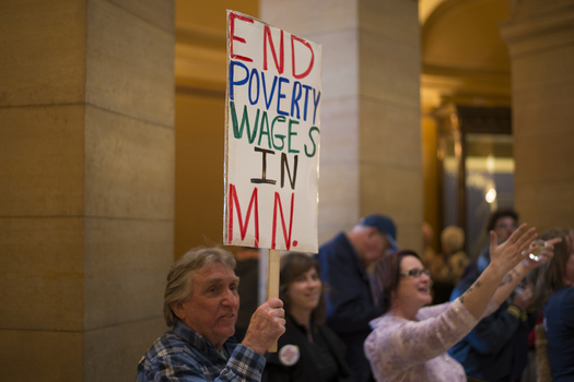 PHOTO: Supporters rallied at the 2014 Legislature for a higher minimum wage, and the first phase of the increase to $9.50 an hour begins Friday, with a bump from $7.25 to $8.00. Photo credit: Fibonacci Blue/Flickr.
