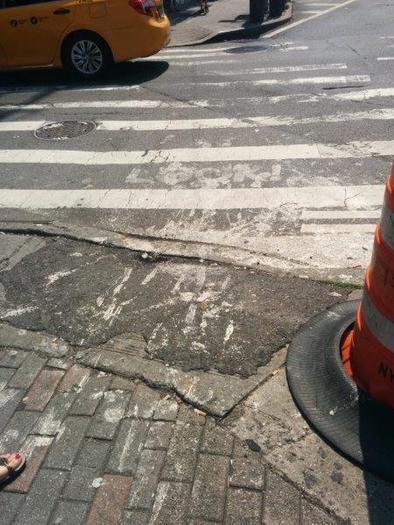 PHOTO: A federal lawsuit charges the City of New York with failing to make sidewalks safe for New Yorkers with disabilities. Photo courtesy of CIDNY. 