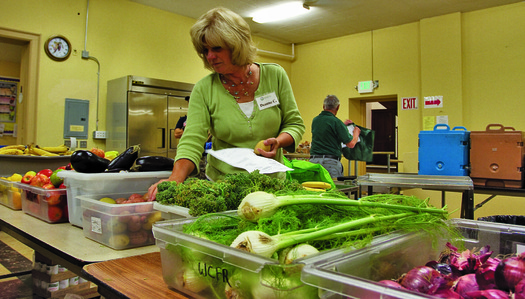 PHOTO: A volunteer prepares food at the Women and Childrens Free Restaurant in Spokane. The food-assistance program helps clients supplement SNAP benefits that don't always cover food needs. Photo courtesy Northwest Harvest. 