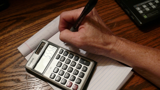 PHOTO: Figures show an improving economy in 2013, according to the Census Bureau, but some experts caution the recovery is still not adding up to financial security for many middle and low-income Kentuckians. Photo by Greg Stotelmyer.