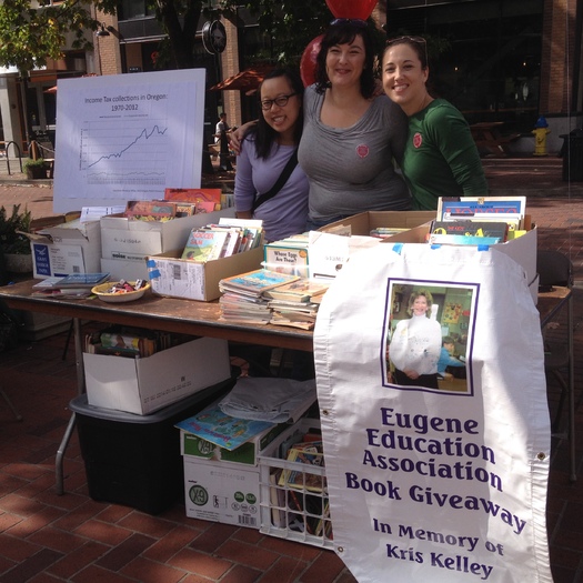 PHOTO: A book giveaway was part of the Eugene event for the Oregon Education Association's Week of Action. This week's message at education forums and fairs statewide is that strong public schools and colleges build strong communities. Photo courtesy Oregon Education Assn.