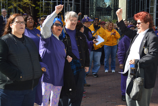 PHOTO: Kim McGowan (right) is among the security guards working for private contractors who say today's security challenges call for more training and better pay. They rallied in Downtown Pittsburgh on Wednesday. Photo credit: Maria Montano.