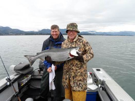 PHOTO: Fishermen with a Tillamook Bay Chinook taken on spinners in the middle bay on Tuesday. Fall Chinook are among the most stable wild salmon populations in Oregon, largely because they don't spend as much time in fresh water streams as others. Photo courtesy of Bob Rees.