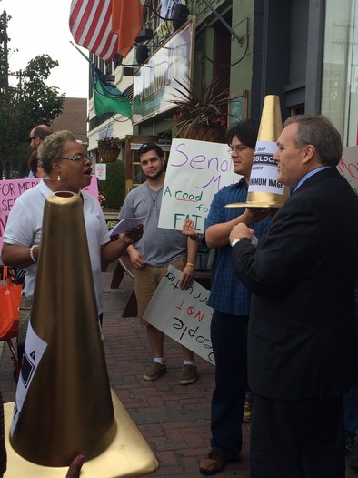 PHOTO: A staffer from State Sen. Jack Martins' office exchanged words with several dozen Long Islanders who delivered so-called 