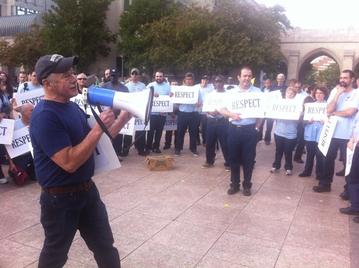 PHOTO: About 100 workers from Boston University marched during rush hour Wednesday to press for a cost-of-living increase and health care benefits. Photo credit: E. Villasante. 