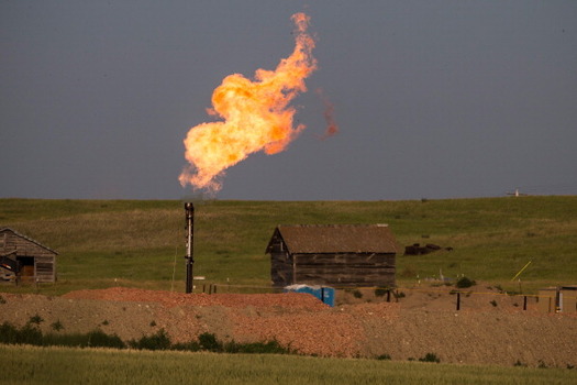 PHOTO: A new report encourages Montana to strictly limit the flaring of natural gas, often considered a byproduct of oil drilling. Courtesy of NASA.