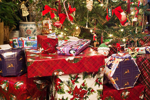 PHOTO: While it's hard not to let the children tear into the wrapping paper, experts say saving it for another use, or recycling it where possible, is just one way to reduce the impact of the holiday on the environment. Photo credit: earl53/morguefile.com. 