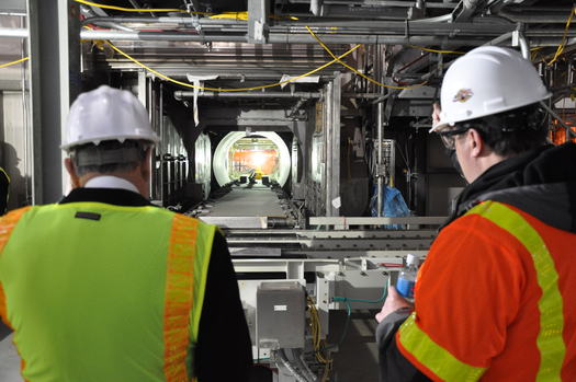 PHOTO: Site Project Manager Jeff Brubaker (right) examines a metal parts treater, part of the huge plant that is expected to begin destroying 523 tons of chemical agents by 2018, stored at the Blue Grass Army Depot. Photo courtesy Blue Grass Chemical Activity.