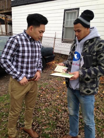 PHOTO: A canvasser from the Cambodian Mutual Assistance Association talks to a resident about open enrollment and his health care options in Lowell, MA as part of Health Care For All’s campaign “Apply Now, Stay Covered” Photo courtesy Cambodian Mutual Assistance Association.