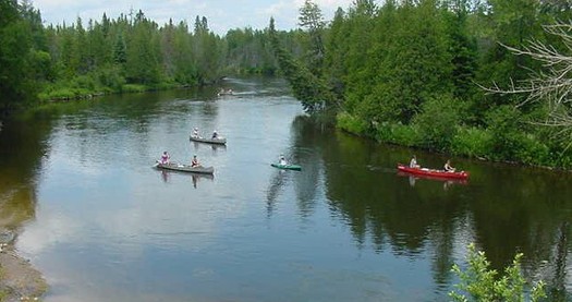 PHOTO: People come from around the country to enjoy Michigan's Au Sable River, which is why one group wants the federal government to study the potential risks of a 60-year-old oil pipeline that runs beneath it. Photo courtesy of Wikimedia Commons.