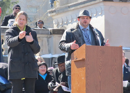 Photo: It still takes a pardon from the governor for nearly a quarter of a million former felons, including Mike Hiser (at podium), to get their right to vote back. Hiser is participating in a rally at the state Capitol on Thursday in support of a bill calling for a public vote on the automatic restoration of voting rights. Photo courtesy of Kentuckians For The Commonwealth.