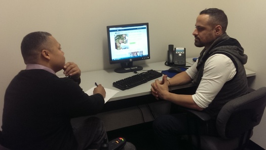 PHOTO: CIDNY counselor advises consumer on insurance options. Courtesy: CIDNY