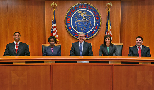 PHOTO: Tom Wheeler (center), chairman of the Federal Communications Commission, is seeking to regulate the Internet as a utility to ensure a level playing field for all Internet users. Photo courtesy Federal Communications Commission.