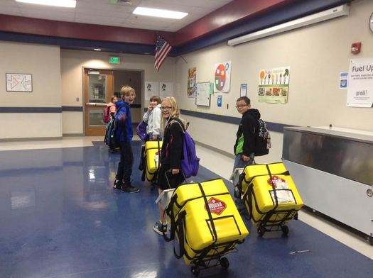PHOTO: For kids at Hoquiam's Central Elementary School, fetching their classroom's portable breakfast cooler is a coveted responsibility at the start of each day. Every child eats a nutritious breakfast in the classroom. Photo courtesy Hoquiam School District.