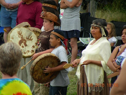 PHOTO: Members of the Swinomish Tribe, seen here at a tribal ceremony, are concerned that long trains of oil tank cars are crossing their reservation every week, a development the Tribe says violates its 1991 easement agreement with a rail company. Photo credit: Leslie Dierauf/U.S. Geological Survey.
