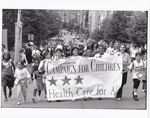 Health Care For All's 1996 victory march after state lawmakers passed legislation creating MassHealth and expanded coverage for kids. The group's 30th anniversary will be celebrated tonight in Boston. Courtesy: Health Care for All.