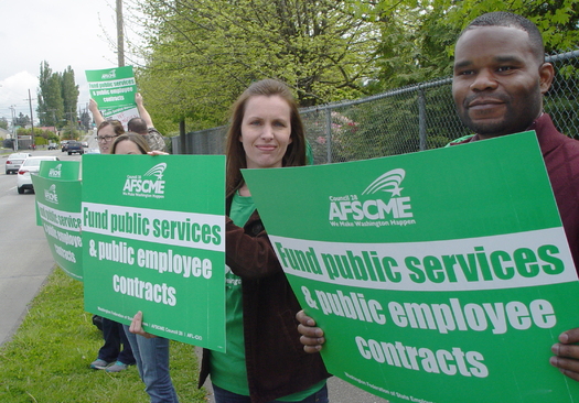 PHOTO: Workers from the Department of Social and Health Services show the placards they'll sport for Wednesday's 15-minute unity break, a coordinated action in more than 80 locations to show solidarity among state workers. Photo courtesy Washington Federation of State Employees.