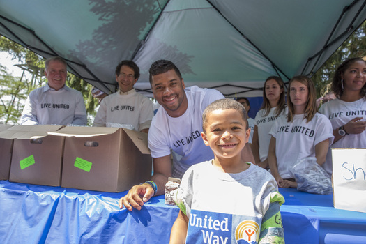 PHOTO: You never know who might show up at a summer meal site! Seattle Seahawks' quarterback Russell Wilson visited with kids last summer to help United Way-sponsored sites reach a summer goal of serving 1 million meals. Photo courtesy United Way of King County.