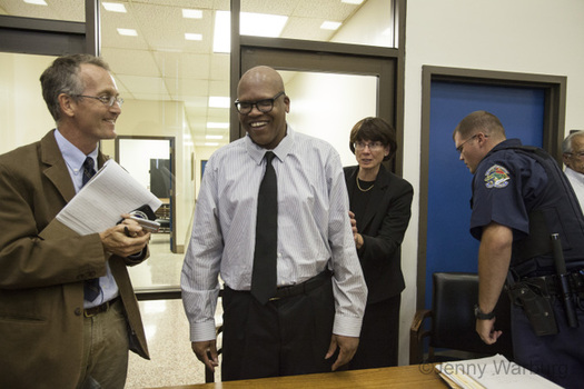 Photo: Leon Brown (center) and Henry McCollum received a pardon of innocence from Gov. Pat McCrory after spending 30 years on death row. Photo courtesty: Jenny Warburg