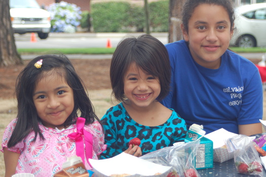 Three sisters enjoy a summer lunch at a Beaverton city park. Summer meal programs in Oregon aren't always indoors, and some providers find they can feed more children with mobile meal delivery. Courtesy: Partners for a Hunger-Free Oregon.