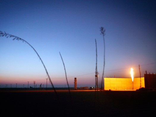 PHOTO: A flare burns at an oil field near Bakersfield. Environmental groups filed suit Wednesday to stop additional fracking and oil drilling on BLM land in California. Photo credit: Chris Jordan-Block/Earthjustice.