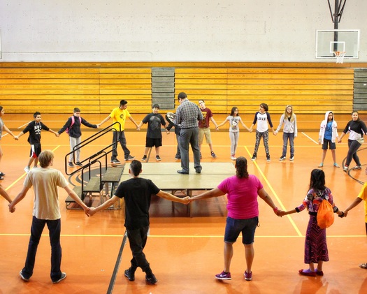 PHOTO: Program director Nation Wright leads a traditional Native American round dance with students at Minnesota's American Indian Freedom Schools program, the first of its kind among the more than 200 Freedom Schools sites across the United States. Photo courtesy of CDF-Minnesota.