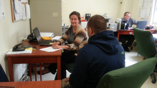 SNAP coordinator Beth Zambia talks with a veteran at the Soldier On shelter in Leeds. At least 26,000 low-income veterans rely on SNAP benefits in the Commonwealth. Courtesy: Food Bank of Western Massachusetts.
