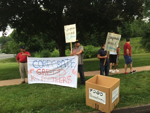 Displaced office cleaners staged an action Wednesday afternoon in front of an office building in Rocky Hill, where they say their contracts were abruptly cancelled, despite some working 15 years or more in the building. Courtesy: 32BJ SEIU.