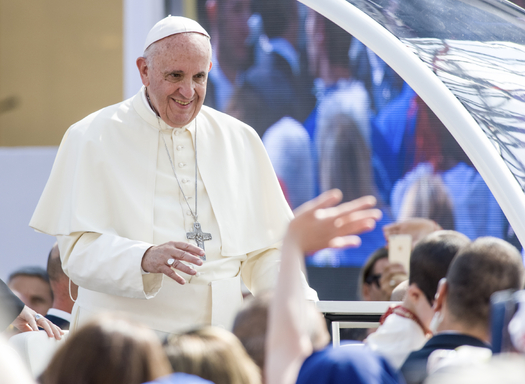 Pope Francis greets a crowd during a recent visit in Turin, Italy. Credit: Nico_Campo/iStockPhoto