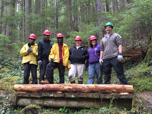 Members of the Pacific Northwest National Scenic Trail Association show off their handiwork, built to go over the Dungeness River in Olympic National Forest. Courtesy: U.S. Forest Service