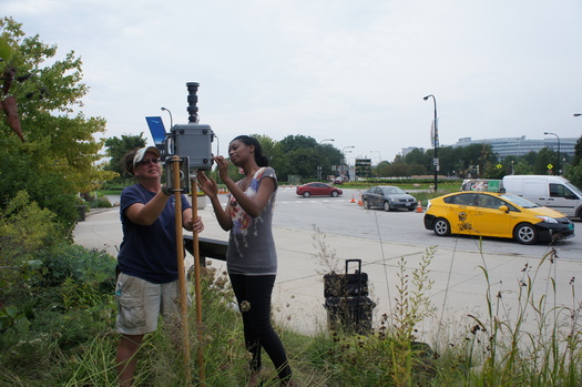 Chicago volunteers help with an air monitor to measure diesel emissions. Credit: ELPC