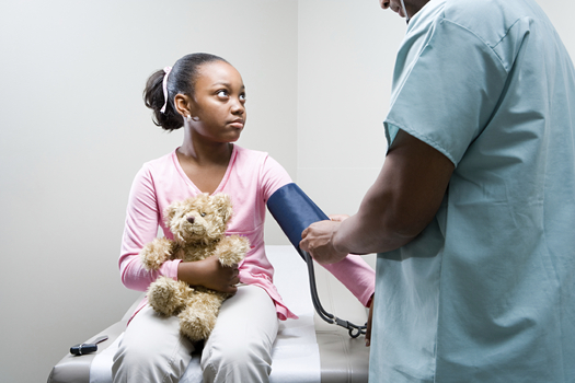 One year after the rollout of the Affordable Care Act, the uninsured rate for children is at a historic low, according to a new report. Credit: XiXinXing/iStockphoto.
