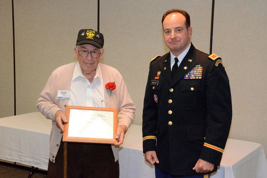Iowa National Guard Col. Gregory Hapgood, right, presents a plaque to Harold Cline of Marshalltown for participating in this month's Veterans History Project. Credit: Lauren Jensen
