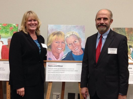 Nancy Madsen-Wilkerson, Utah's 2015 Portrait of Care honoree, with a painting of her and her mother. Credit: AARP Utah