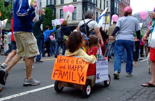 A family is part of a recent Gay Pride parade. A Utah legislator wants to give heterosexual families preference over gays in adopting children in the state. (Wikimedia Commons)