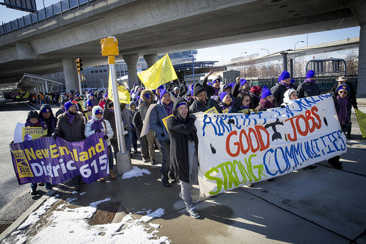 Logan Airport workers rally today in support of a bill getting a State House hearing to boost airport workers' pay to $15 an hour. (SEIU) 