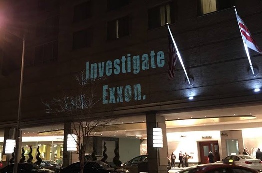 Environmentalist projected images onto the site of the NAAG meeting in Washington. (350.org)