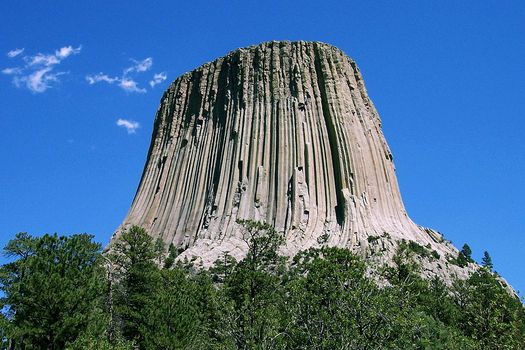 A new report shows counties in Wyoming with more public lands, such as Devils Tower National Monument in Crook County, fare better than counties with less. (Colin Faulkingham/Wikimedia Commons)