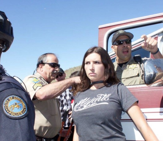 Jacinta Gonzalez (center) was arrested on Saturday near Phoenix for blocking traffic on a road leading to a political rally for presidential candidate Donald Trump. (Mijente)