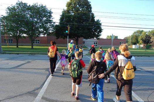 Walking School Bus programs encourage students to walk to class instead of riding in a bus or car. (American Heart Association)