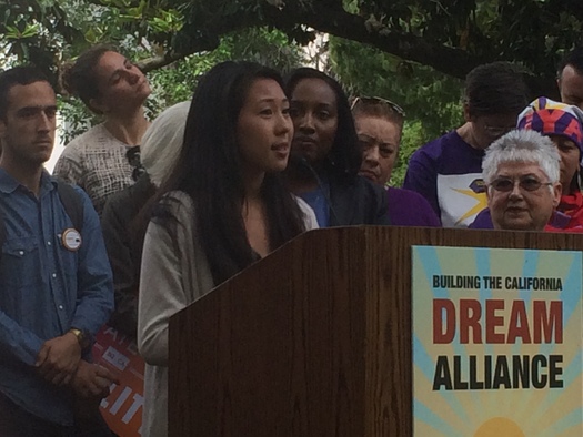 Laiseng Saechao from the Asian Pacific Environmental Network speaks at a press conference Wednesday announcing the 