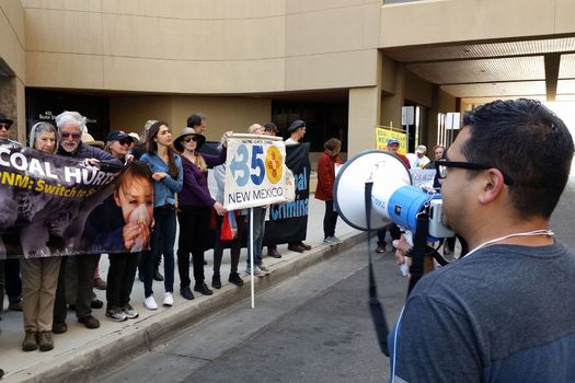 Dozens of protesters rallied outside PNM headquarters in Albuquerque and at a shareholders' meeting near Dallas on Tuesday to oppose the company's proposed rate hikes. (350.org)