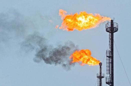 Flares burn off excess gas at an oil production facility. On Tuesday California proposed new inspections to prevent leaks. (Environmental Defense Fund)