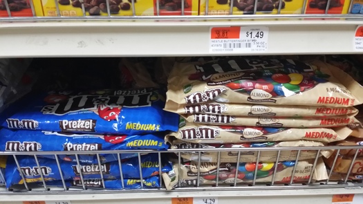 Some products, including M and M's, will be found with GMO labels on Bay State store shelves thanks to a new Vermont labeling law that faces a challenge in the U.S. Senate (M. Clifford).